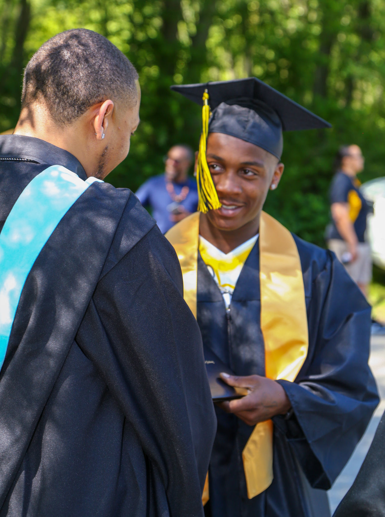 The last graduating class from Roosevelt College and Career Academy graduates
